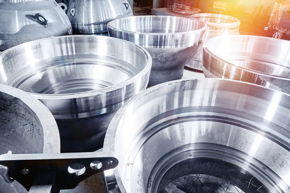 A group of metal pots sitting next to each other.
